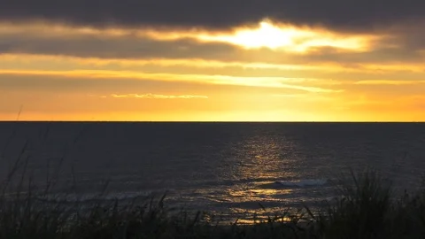 Dawn Skies Over Dark Ocean Waves 4K - Relaxing Nature Background Stock Footage 106931283