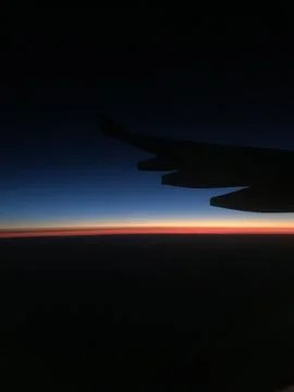 Dawn sky during the flight Stock Photos