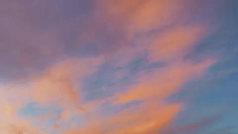 Dawn sky painted with soft pink and orange hues blending into serene blue Stock Footage 319201899