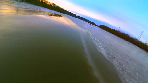 Dawn sky reflected in the thin ice of a new day Stock Footage 295298144
