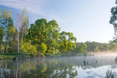 Dawn on the slow river Stock Photos
