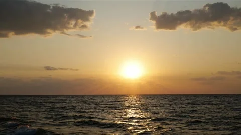Dawn the sun rises over the sea timelaps Stock Footage 244657679