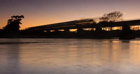 Dawn train bridge Stock Photos