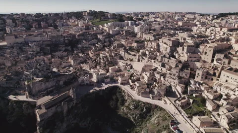 Day aerial over the Ancient Jerusalem looking city of Matera in Basilicata Stock Footage 241173403