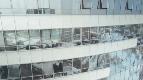 The day city is reflected in the large windows of a multi-storey building. The Stock Footage 152038913
