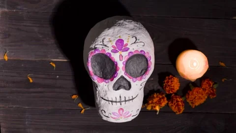 Day of the Dead Calavera Sugar Skull Prop on Wooden Table with Candle Stock Footage 343544468