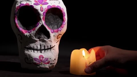 Day of the Dead Calavera Sugar Skull with Candlelight for Festive Visuals and Stock Footage 343544481