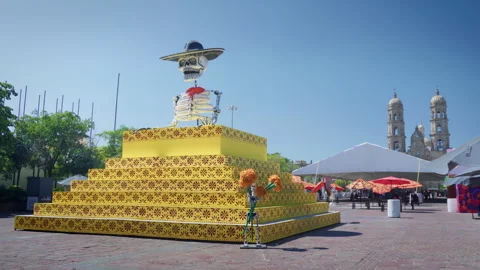 Day of the Dead decoration pyramid and skeleton at Zapopan Basilica plaza Видео 346328057