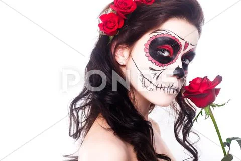 Day of the dead. Halloween. Young woman in day of the dead mask skull face art Stock Photos