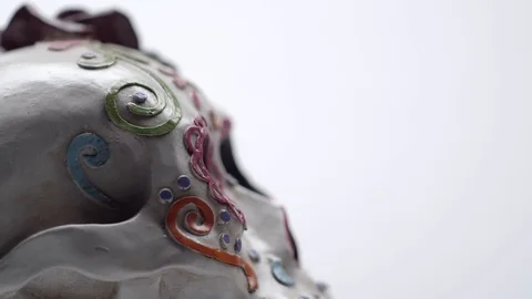 Day of the dead skull turn to camera close up of eye sockets Stock Footage 114086997