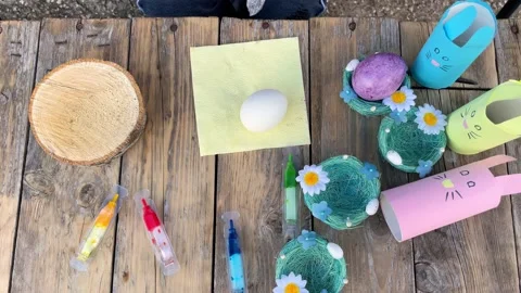 The day before Easter, close-up of children's hands painting eggs Stock Footage 228202676