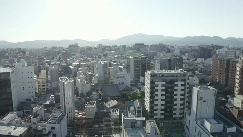 Day flight of the copter over the rooftops of the city of Nagoya Stock Footage 110701129