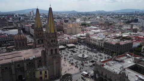 Day flying counter clockwise around central plaza of Guadalajara Mexico Stock Footage 170676239