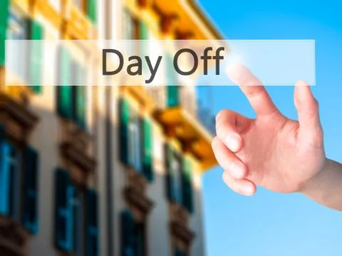 Day Off - Hand pressing a button on blurred background concept on visual scre Stock Photos