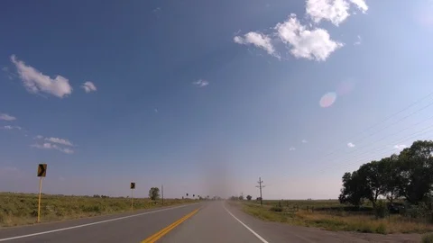 Day hyperlapse down long rural 2 lane highway Stock Footage 95768749