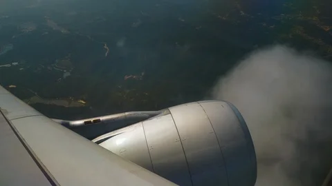 Day light flying airplane engine window view panorama 4k china Video stock 94441775