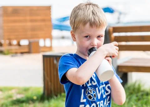 Day light portrait of boy drinking water outdoor Stock-Fotos