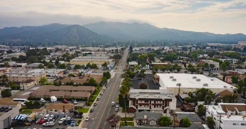 Day, Low Horizontal Move Over City Streets Aerial Motion Time Lapse Stock Footage 129644650