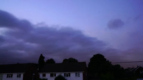 Day night day timelapse over suburban housing clear sky to dramatic Stock Footage 111342567