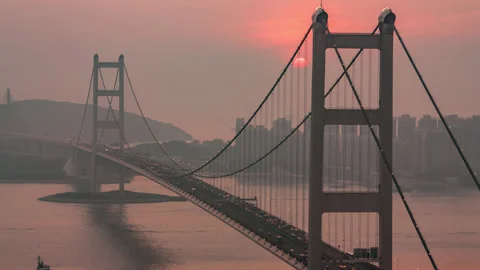 Day to night sundown time-lapse suspension bridge Hong Kong Stock Footage 136525122