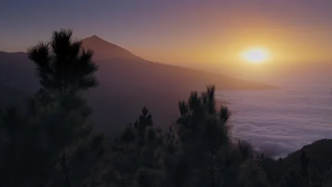 Day to night sunset time lapse over Teide volcano, Sunset over fluffy clouds Stock Footage 143880414
