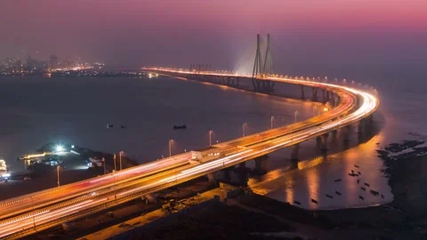 Day to Night Tilting Down Sunset Timelapse of Bandra Worli Sea Link Mumbai India Stock Footage 185890920