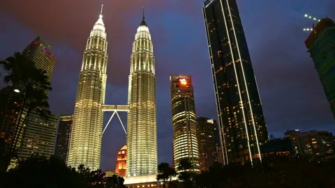 Day to night time lapse 4K video Petronas Twin towers in Kuala Lumpur Stock Footage 235545328