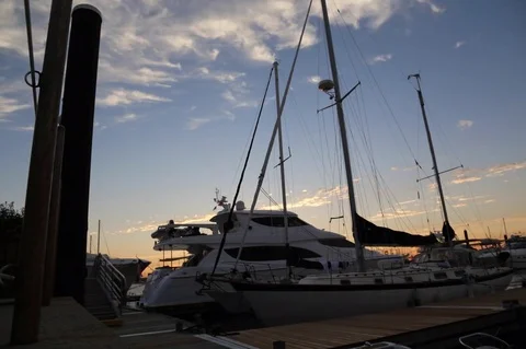 Day to night Time Lapse of Boat in a harbor Stock Footage 79417870