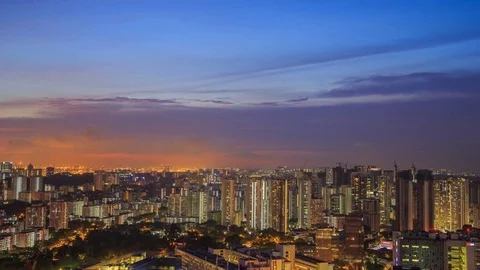 Day to night Time-lapse of cityscape view of Singapore city at sunset Stock Footage