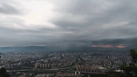 A day night time-lapse with clouds over the city	 Stock Footage 252436197