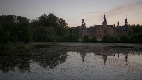 Day to night time lapse of medieval mystical Castle by fishing pond with lili Stock Footage 154502738