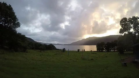 Day to Night time lapse - Night comes swiftly across the loch amidst the Video stock 80100310