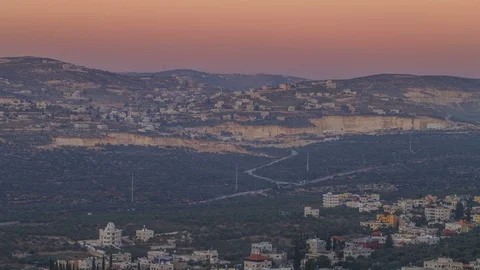 Day to night time lapse of Samaria mountains, arab villages and traffic, 4k Video stock 97744267