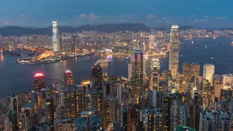 Day to night time lapse of skyline of Victoria harbor of Hong Kong city Stock Footage 153154510