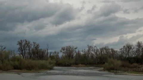 Day To Night Time Lapse Of Storm Clouds Passing Over The Feather River Stock Footage 87774299