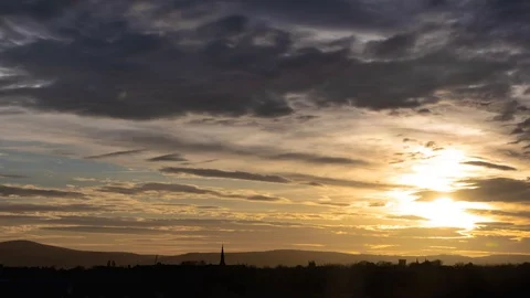 Day to Night Time Lapse of Stratocumulus Clouds Rolling Through Sky While Stock Footage 128297009