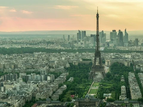 Day to night time lapse of sun setting over Paris skyline with Eiffel Tower Stock Footage 76952690