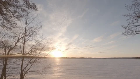 Day to night time lapse. Sunset at winter lake with snow. 4k. Finland. Flat Video stock 87939128