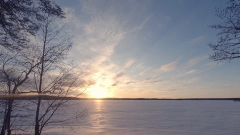 Day to night time lapse. Sunset at winter lake with snow. 4k. Finland. Stock Footage 87939129