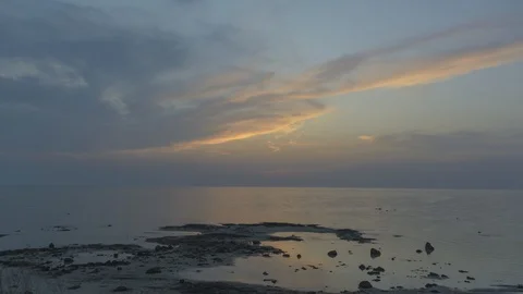 Day to night time lapse of sunset over sea with tide rising Stock Footage 111319007
