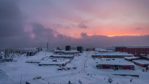 Day to Night Time lapse of a sunset overlooking the houses in Nuuk Stock Footage 247705667