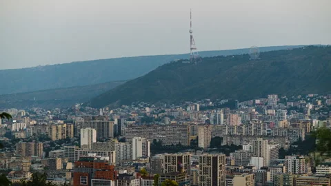 Day to night time lapse of Tbilisi city under Mtatsminda mountain Stock-Footage 289475227