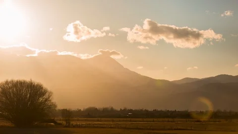 Day to night timelapse of absolutely astounding golden mountain sunset Video stock 88022110