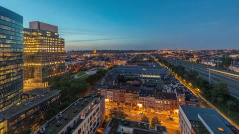 Day to night timelapse of Brussels blending skyscrapers with residential areas. Stock Footage 294720568