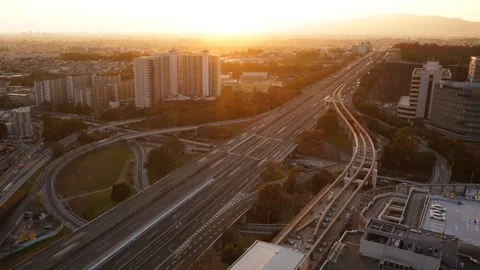 Day to Night Timelapse of Junction Highway Traffic and Light Trails in Osaka Video stock 331938336