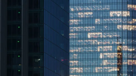 Day-to-night timelapse modern skyscraper facade. Office windows light up Stock Footage 322629530