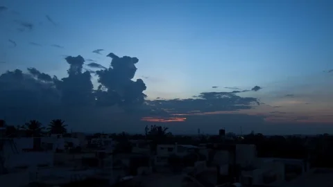 Day to night timelapse shot during sunset shows interesting cloud formation Stock Footage 89038884