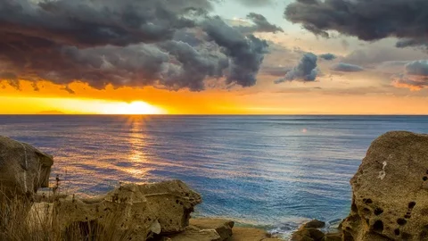 Day to night timelapse of stormy sunset from a beach on a Mediterranean island Stock Footage 85261955
