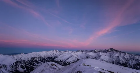 Day to night timelapse - Sunset and Orion rising over the mountains (4K) Stock Footage