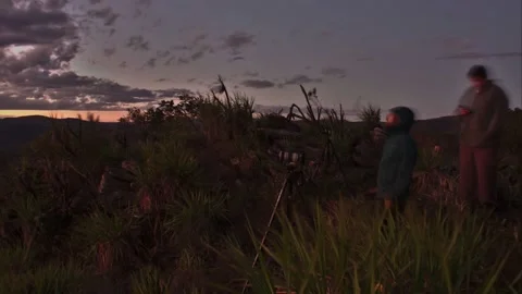 Day to night transition time lapse  of hikers doing a night photography in south Stock Footage 137661063